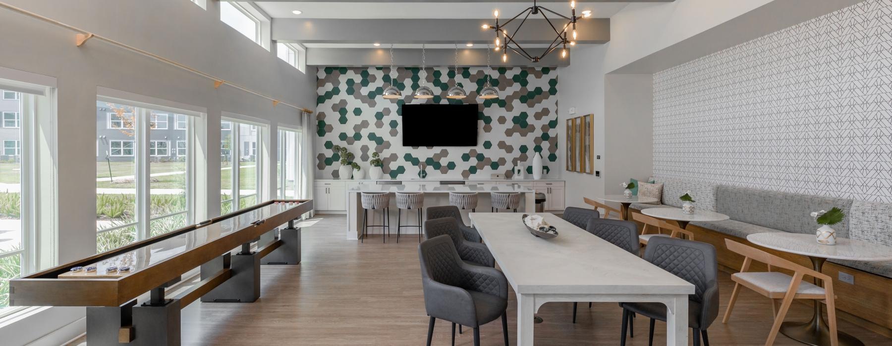 a large room with a table and chairs