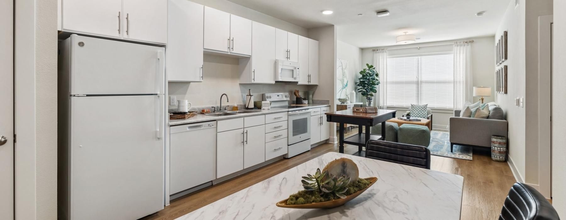 a kitchen with white cabinets